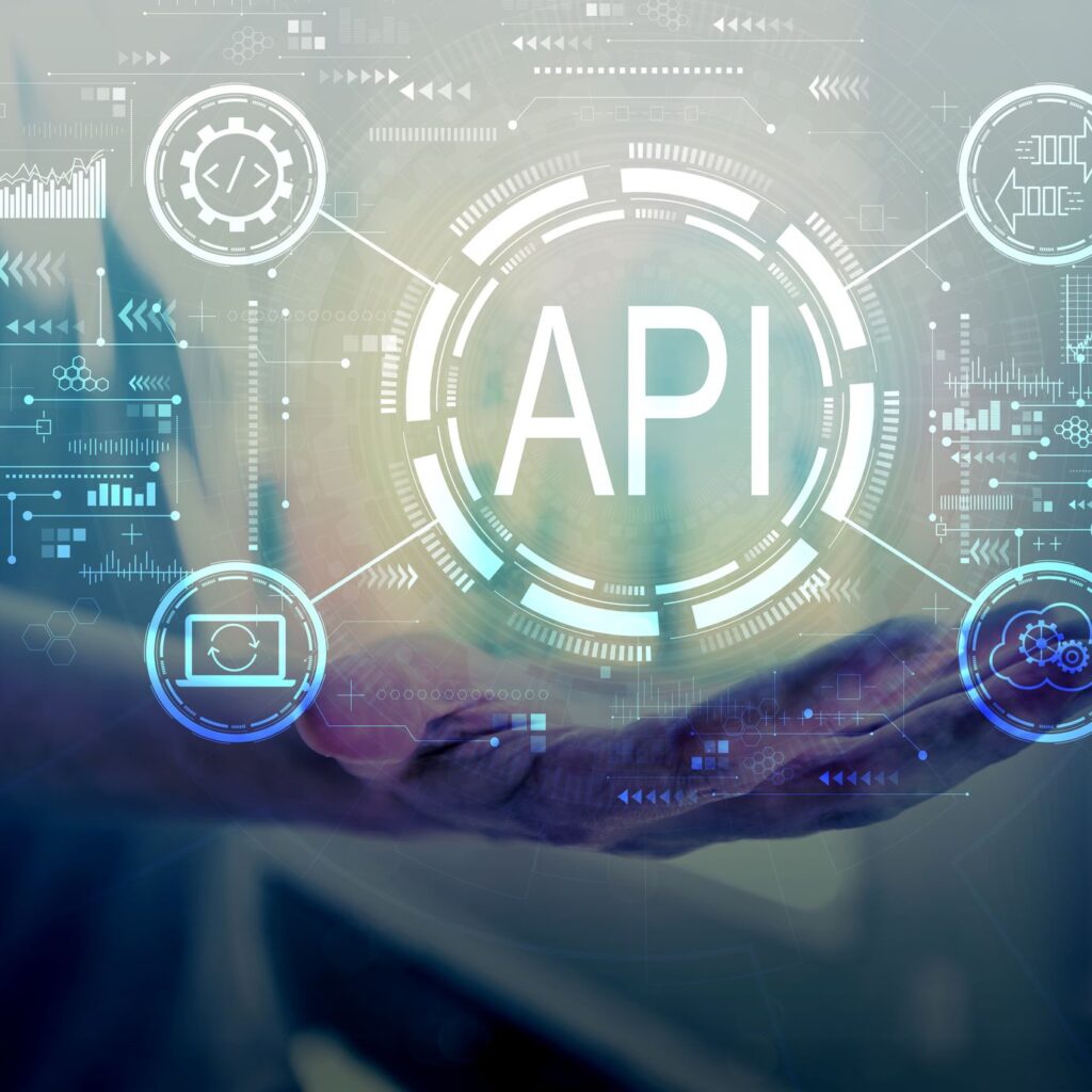 A hand holding a circle with "API" imagery